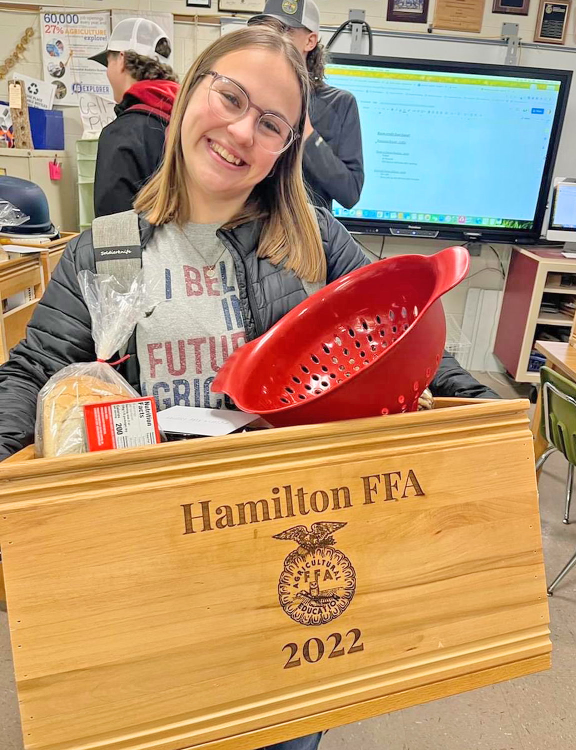 New York State FFA Sentinel and Hamilton Central School FFA member Morgan Craven helps pack Thank a Farmer baskets Dec. 8 at the school.