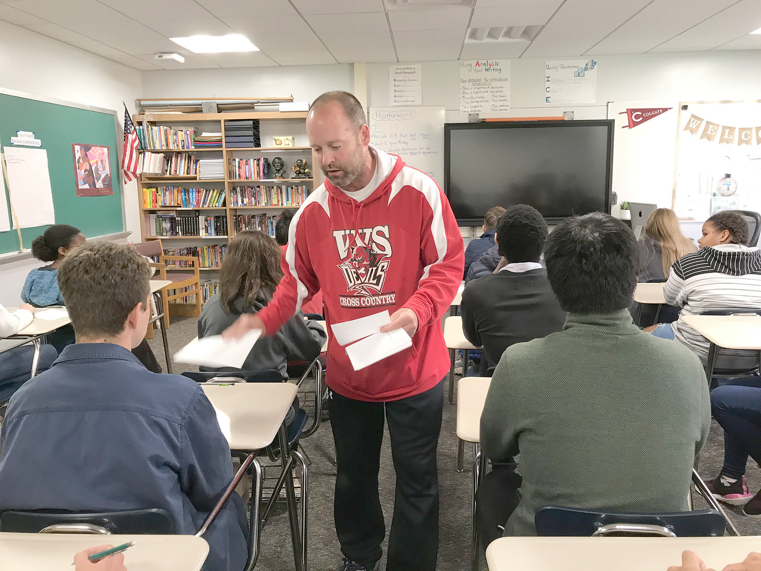 Vernon-Verona-Sherrill Central School Mathletics coach Michael Dunne passes out questions Oct. 15 during the relay race part of the morning’s competition at Hamilton Central School ... just like it was done more than 40 years ago.