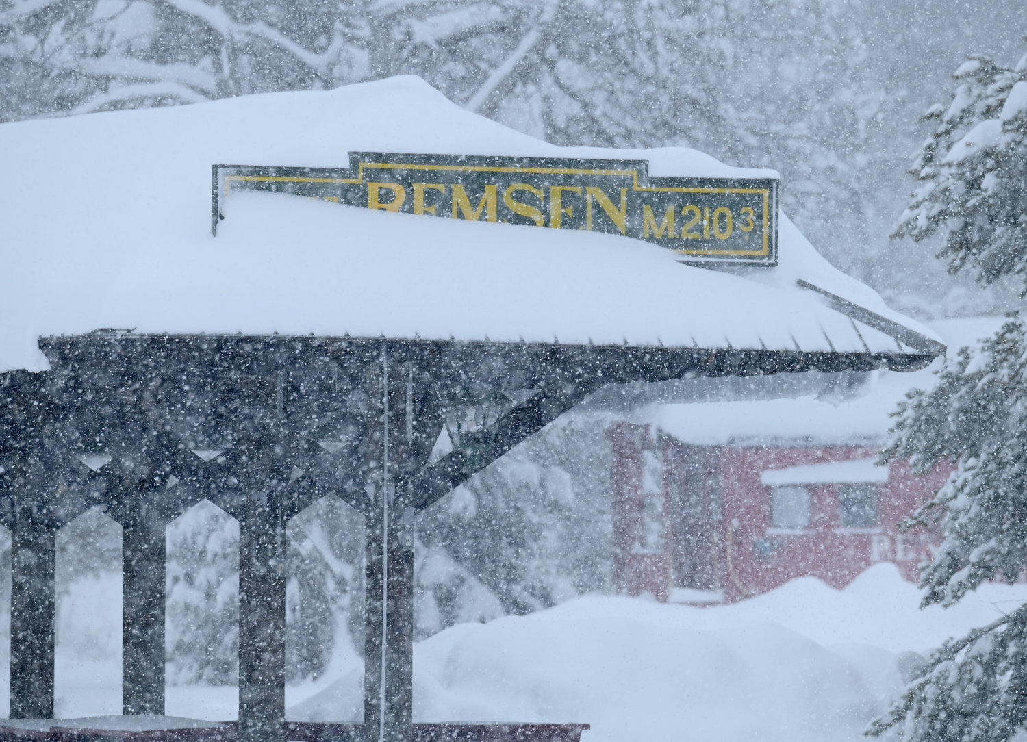 The snow covered Remsen sign at the Remsen Depot Monday, December 19, 2022.