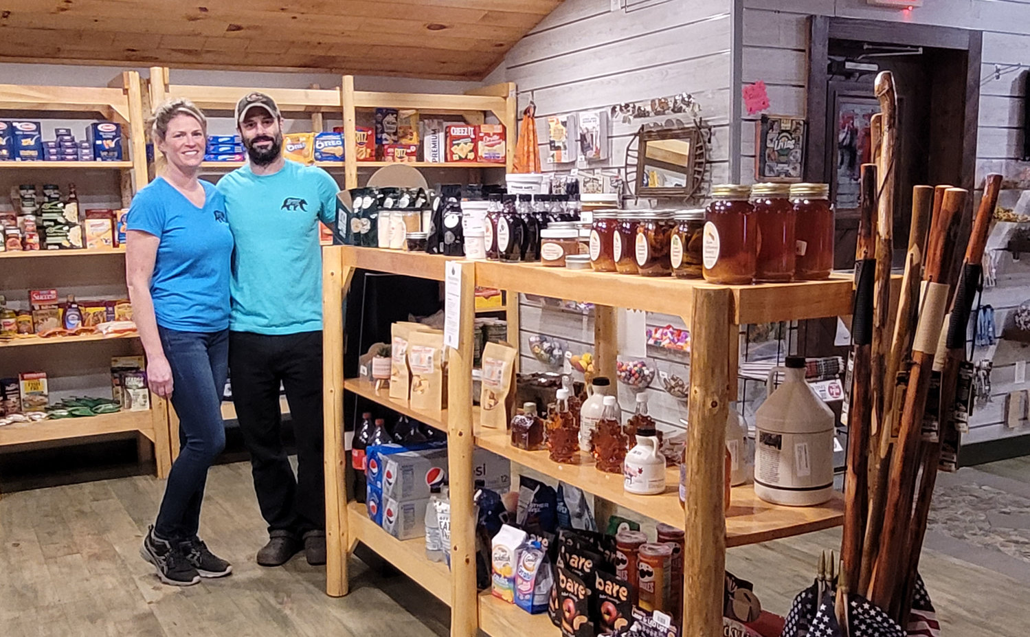 Amy Nelson and Aaron LaBella, both co-owners of Bonnie’s Country Store pause for a photo amid one of the store’s many display areas.