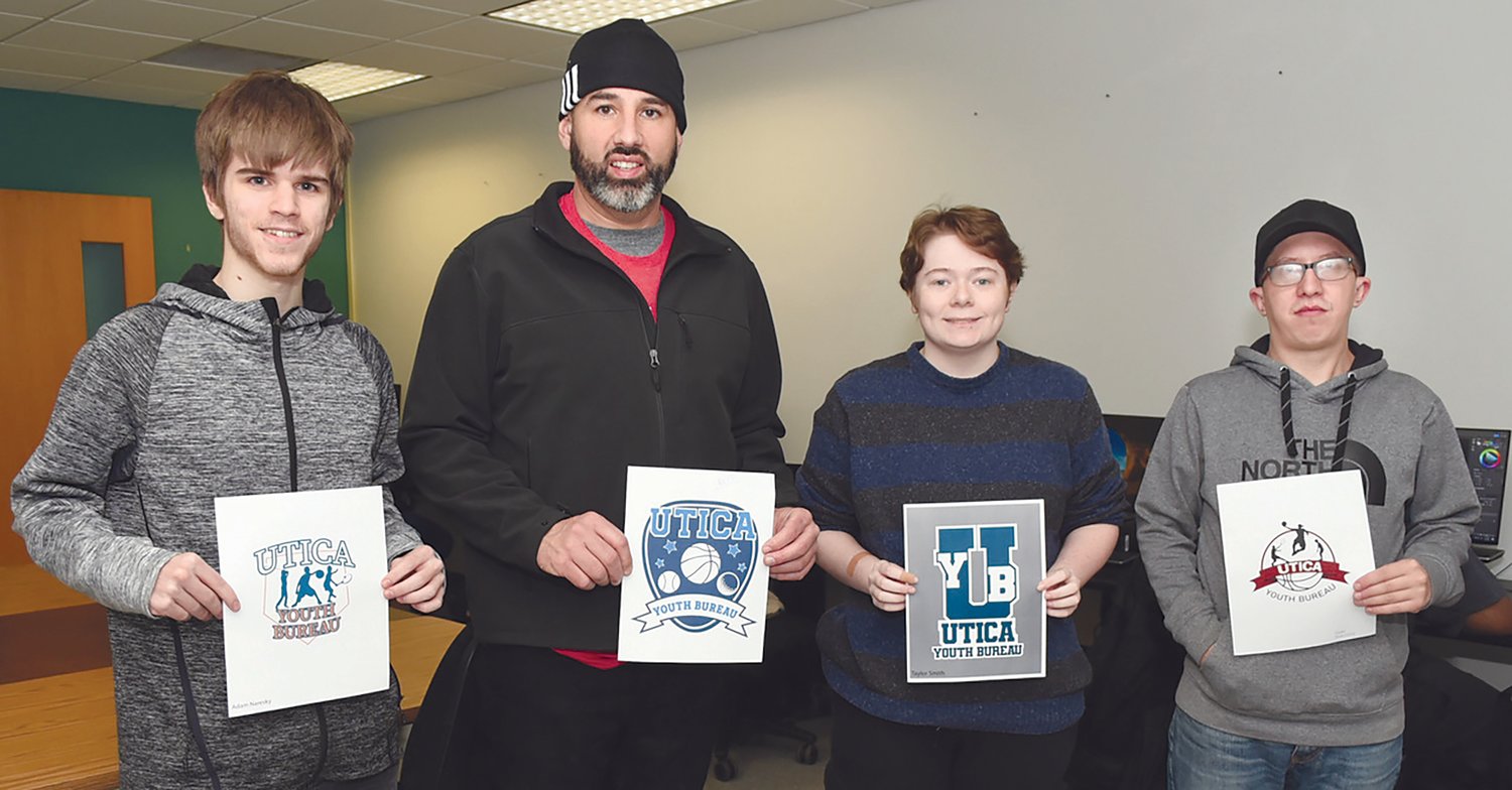 MVCC graphic design students’ logos were recently chosen for use by the City of Utica Youth Bureau. From left are MVCC student Adam Naresky; Utica Youth Bureau Assistant Director Chet LoConti, who is holding the logo designed by MVCC student Kendra Barajas; and MVCC students Taylor Smith and Chad Garnsen.