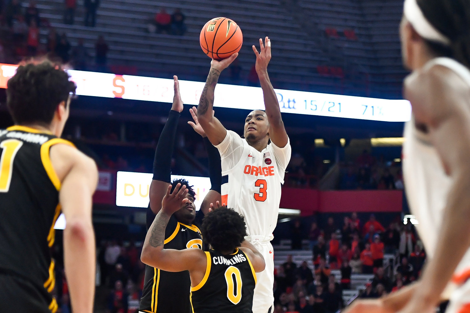 Syracuse guard Judah Mintz takes a shot over Pittsburgh guard Nelly Cummings (0) and forward Blake Hinson as time expired in the second half in Syracuse, Tuesday. Mintz missed and Pittsburgh won 84-82.