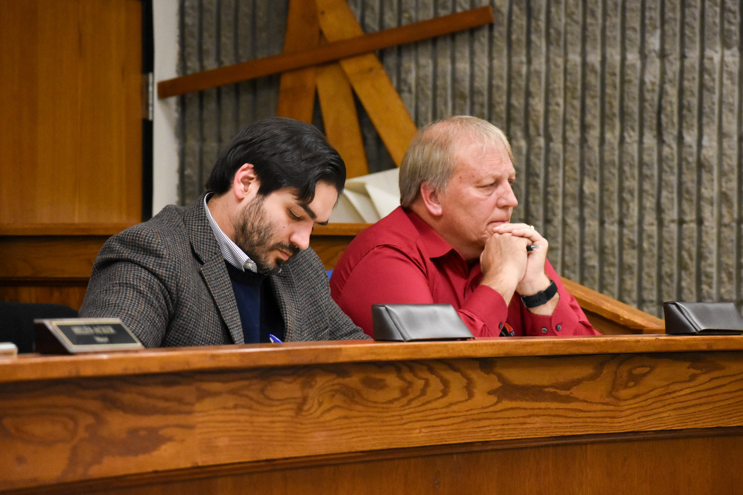 Village of Wampsville Mayor Jerry Seymour (right) and the village’s legal counsel (left) attend a public hearing at Oneida City Hall on Monday, Dec. 19, to discuss a petition requesting a section of Daniels Drive in Oneida to become part of Wampsville.