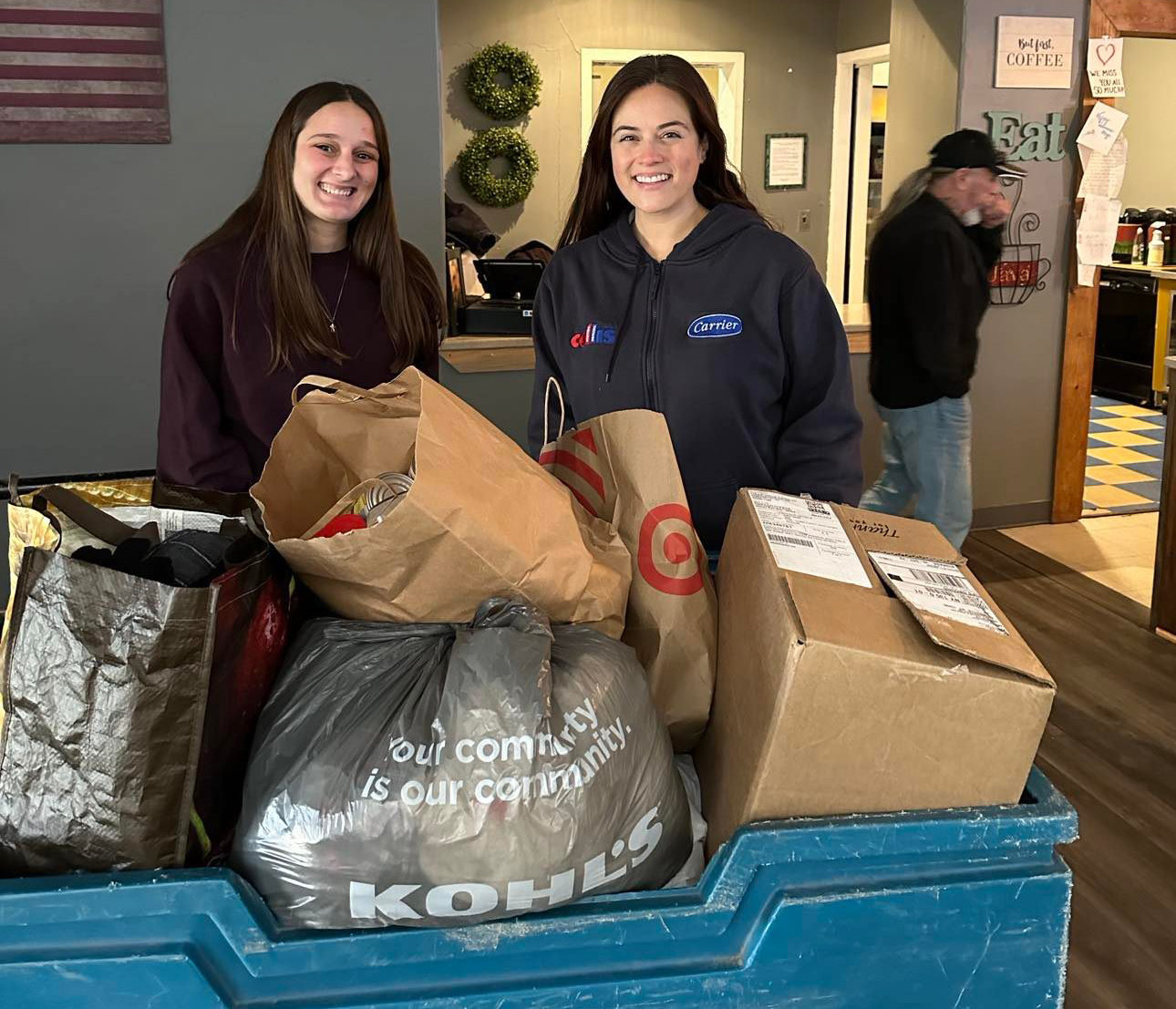 CNY Veterans Outreach Center donation drop off with Collis employee Ally Priore-Quigley and Utica Center for Development employee Kaylee Massocco.