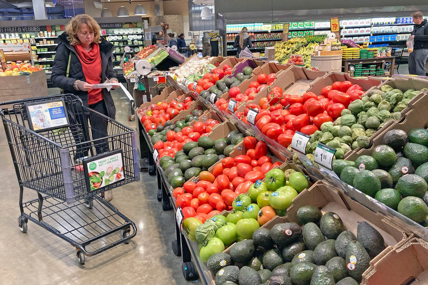 Shoppers pick out items at a grocery store in Glenview, Ill., Saturday, Nov. 19.