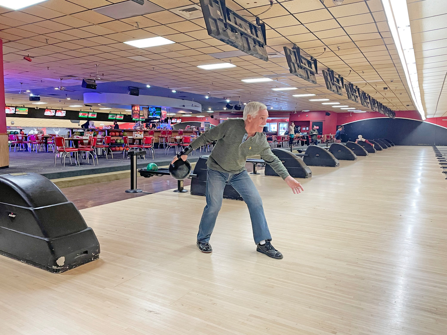 Clifford Crandall Jr. demonstrates his approach at the bowling alley.