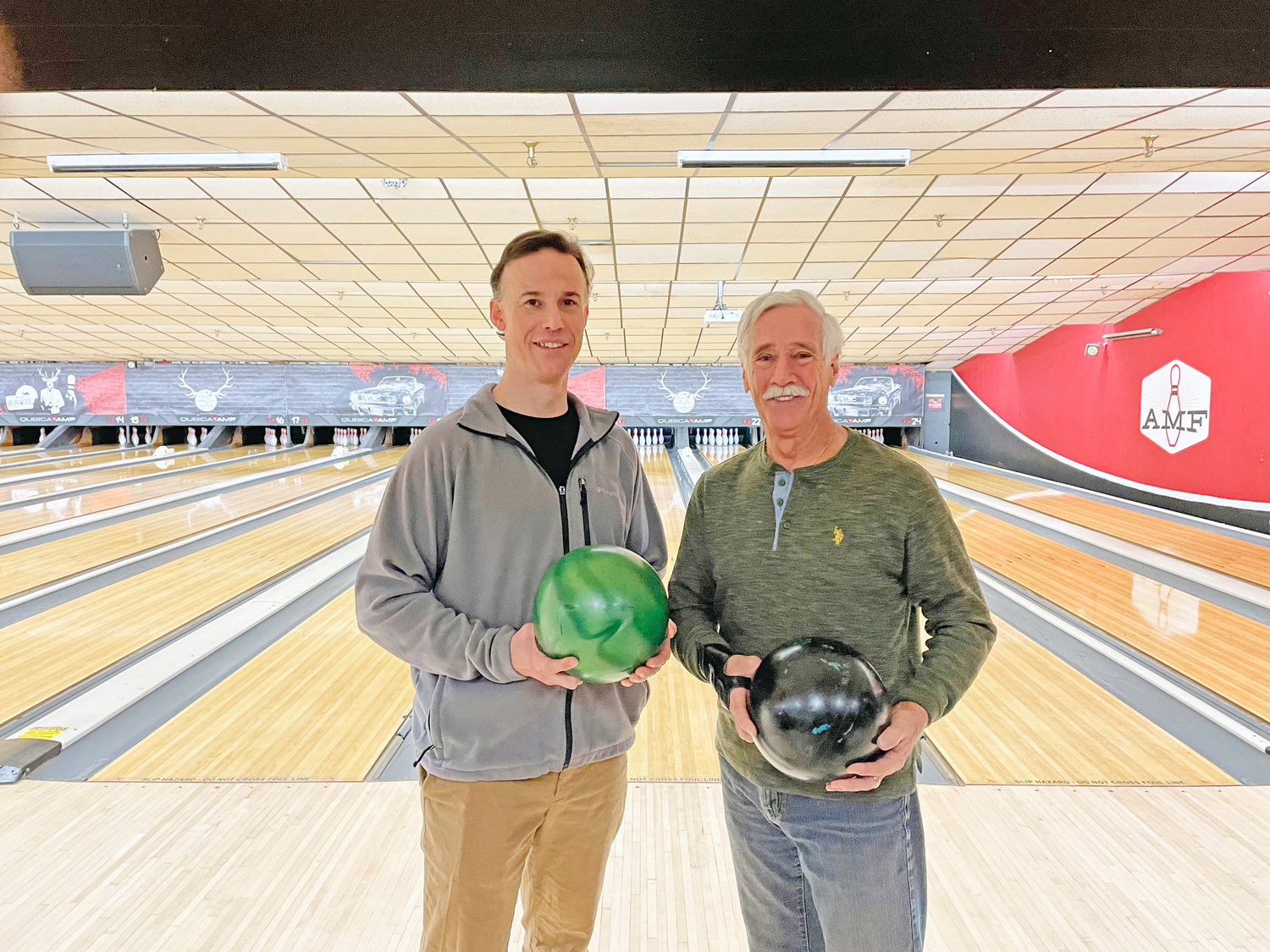 Grandmaster Clifford Crandall Jr., right, and Eric Stalloch after a round of bowling.
