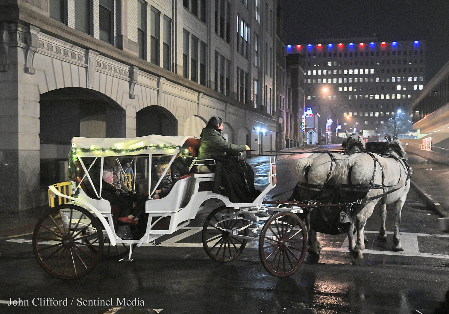 The Bank of Utica New Year's Eve celebration with the horse and carriage rides offered by Lamplit Farms- the carriage was turning up Devereux St. December 31, 2022.