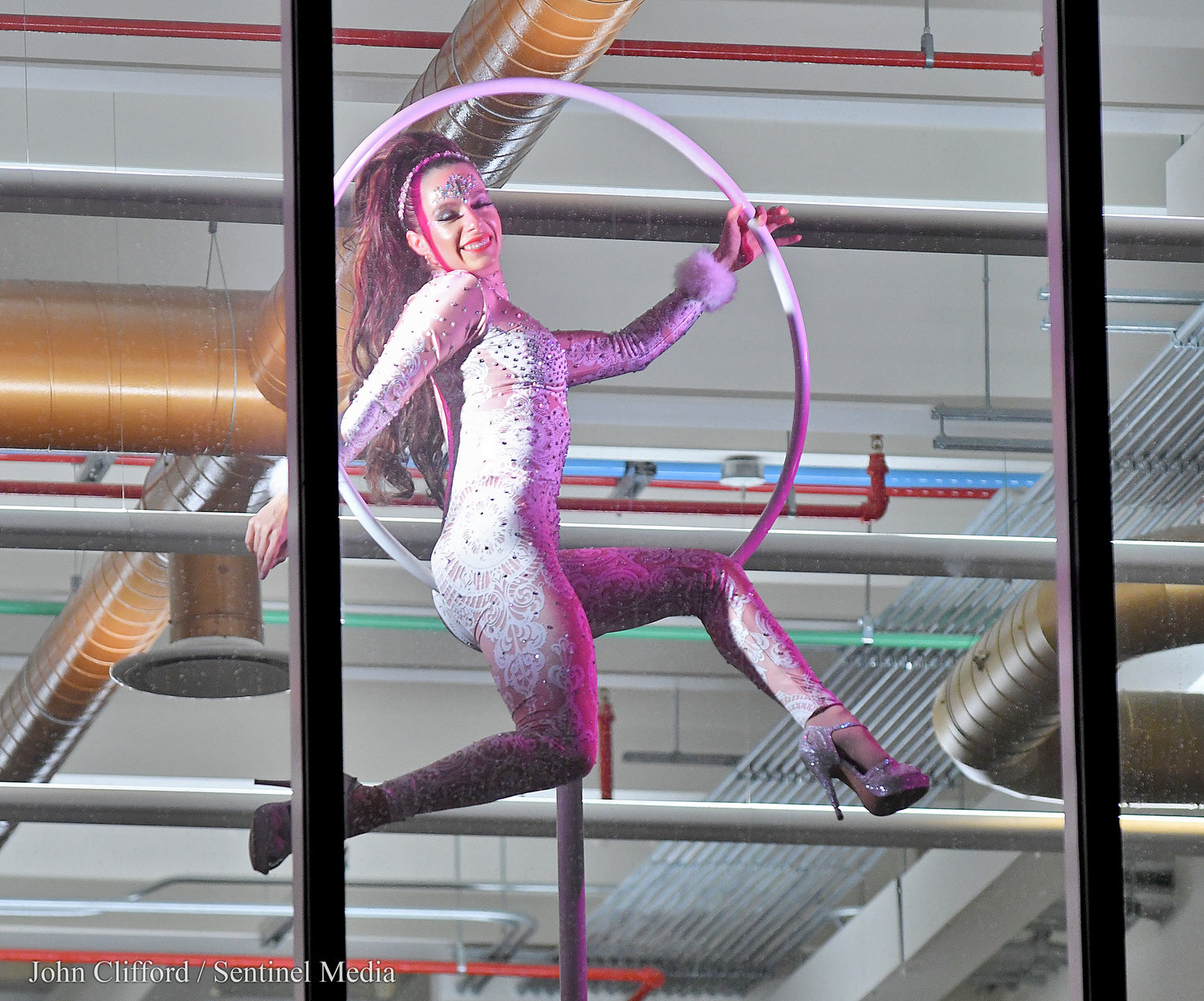 The Bank of Utica New Year's Eve celebration with world class aerialists performing in the windows of the bank for revelers on Genesee St.  Saturday, December 31, 2022.