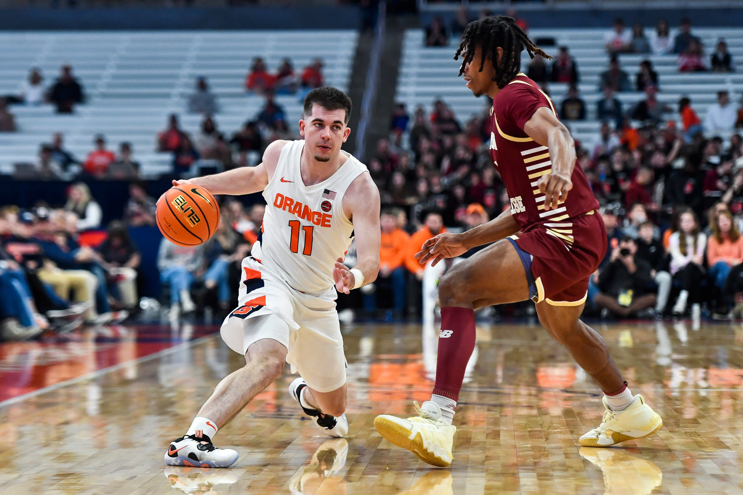 Syracuse guard Joe Girard, left, is defended by Boston College guard DeMarr Langford Jr. during the first half of Saturday's game in Syracuse. Girard scored 24 points at the Orange won 79-65.
