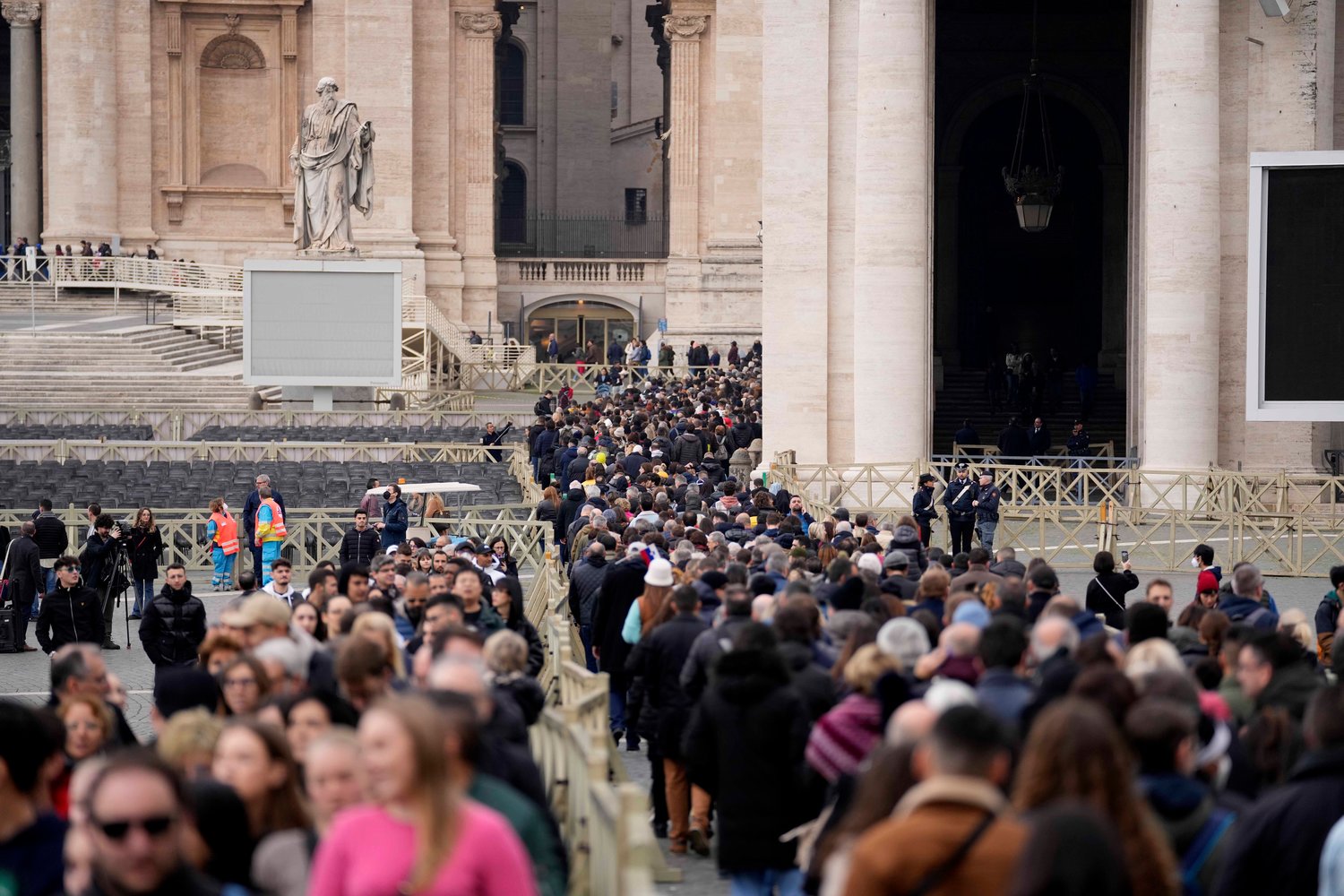 People wait in a line to enter Saint Peter's Basilica at the Vatican where late Pope Benedict 16 is being laid in state at The Vatican, Monday, Jan. 2. Benedict XVI, the German theologian who will be remembered as the first pope in 600 years to resign, died on Saturday. He was 95.