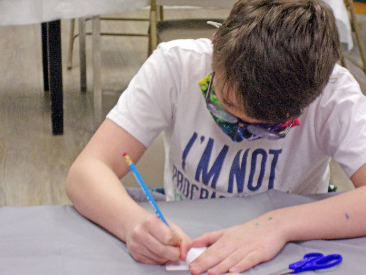 Cooper Lincoln works at one of the creative activity stations at the 2022 Art Time for Families workshops.
