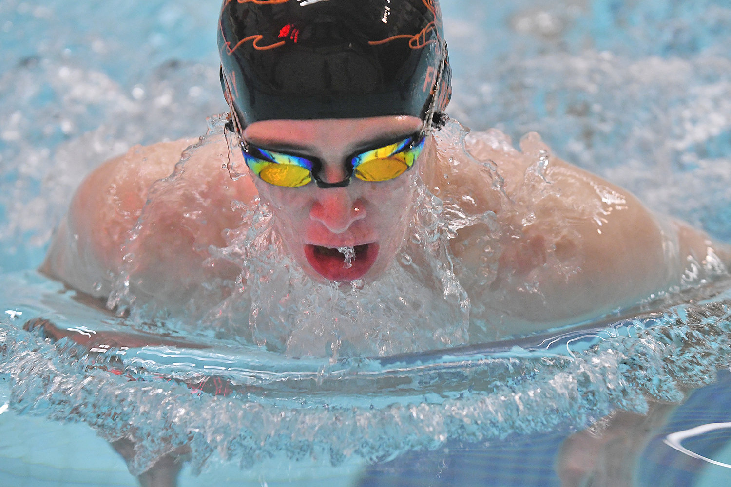 Rome Free Academy's Sean Feeney competes in the breaststroke leg of the 200-yard medley relay on Tuesday at Holland Patent. The Black Knights won the relay, but lost the event 53-49. Feeney also won the 100 backstroke in 1:08.87.