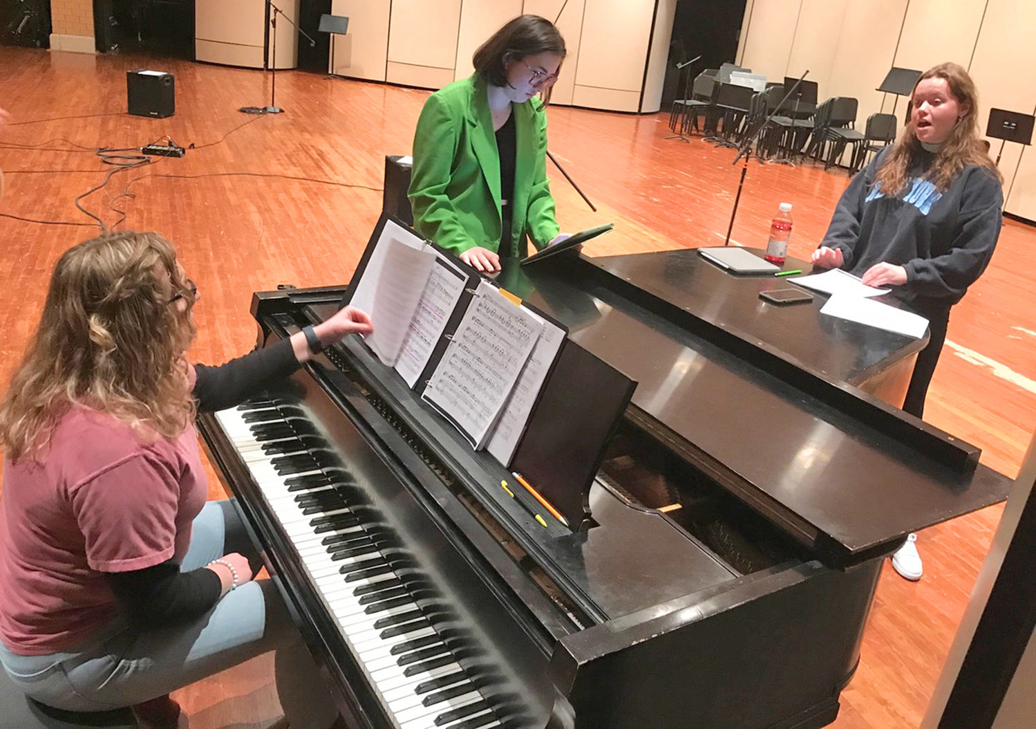 Rome Free Academy graduates, from left, Rebecca Matte, Abbie Morgan and Kayla Bush rehearse Tuesday, Jan. 3 for their 15th annual student and alumni cabaret revue coming Saturday, Jan. 7 to the RFA auditorium.