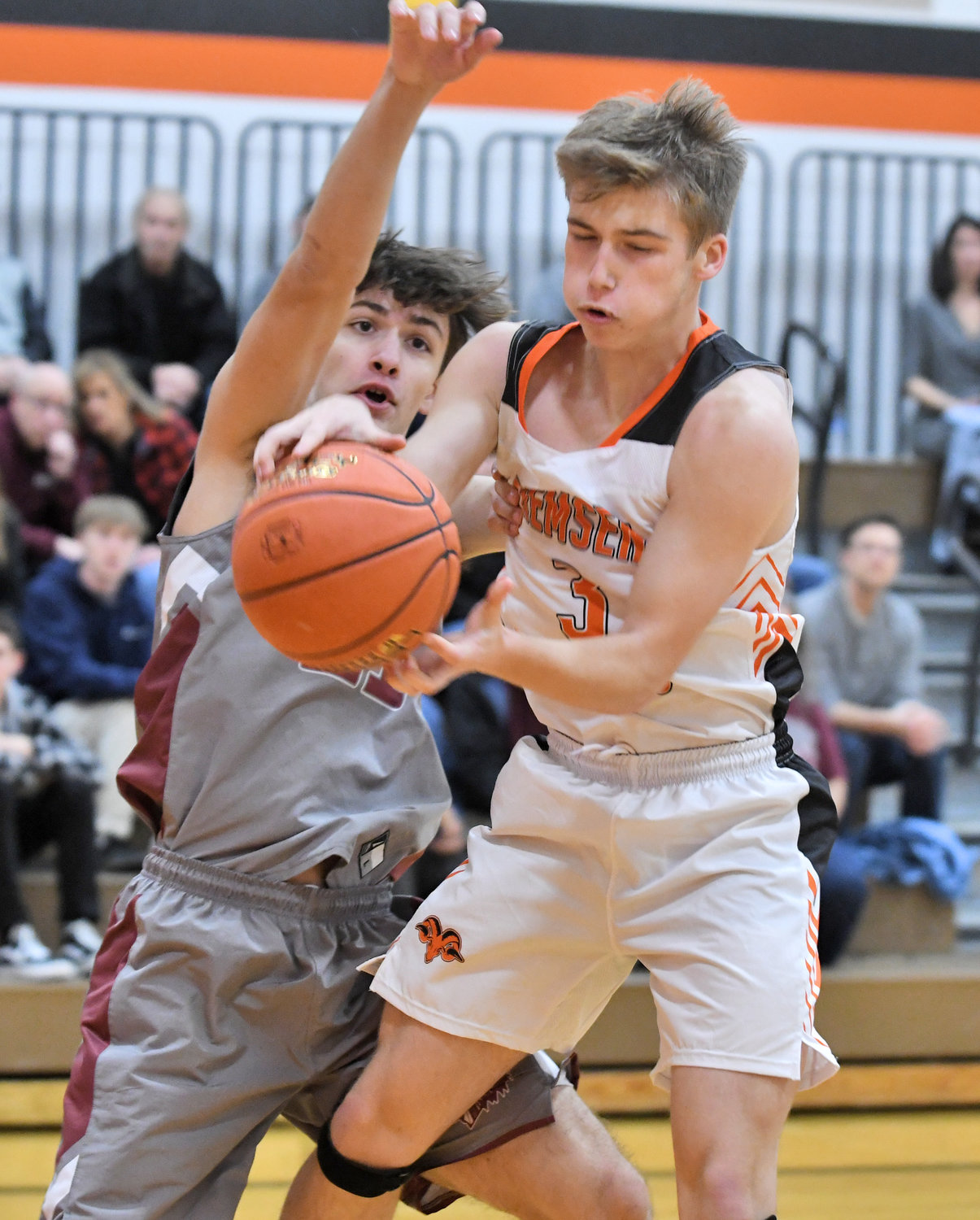 Remsen’s Grady Helmer is guarded by Oriskany’s Karsten Bates in a game in Remsen Thursday. Helmer led the Rams with 18 points but Oriskany won 48-42.