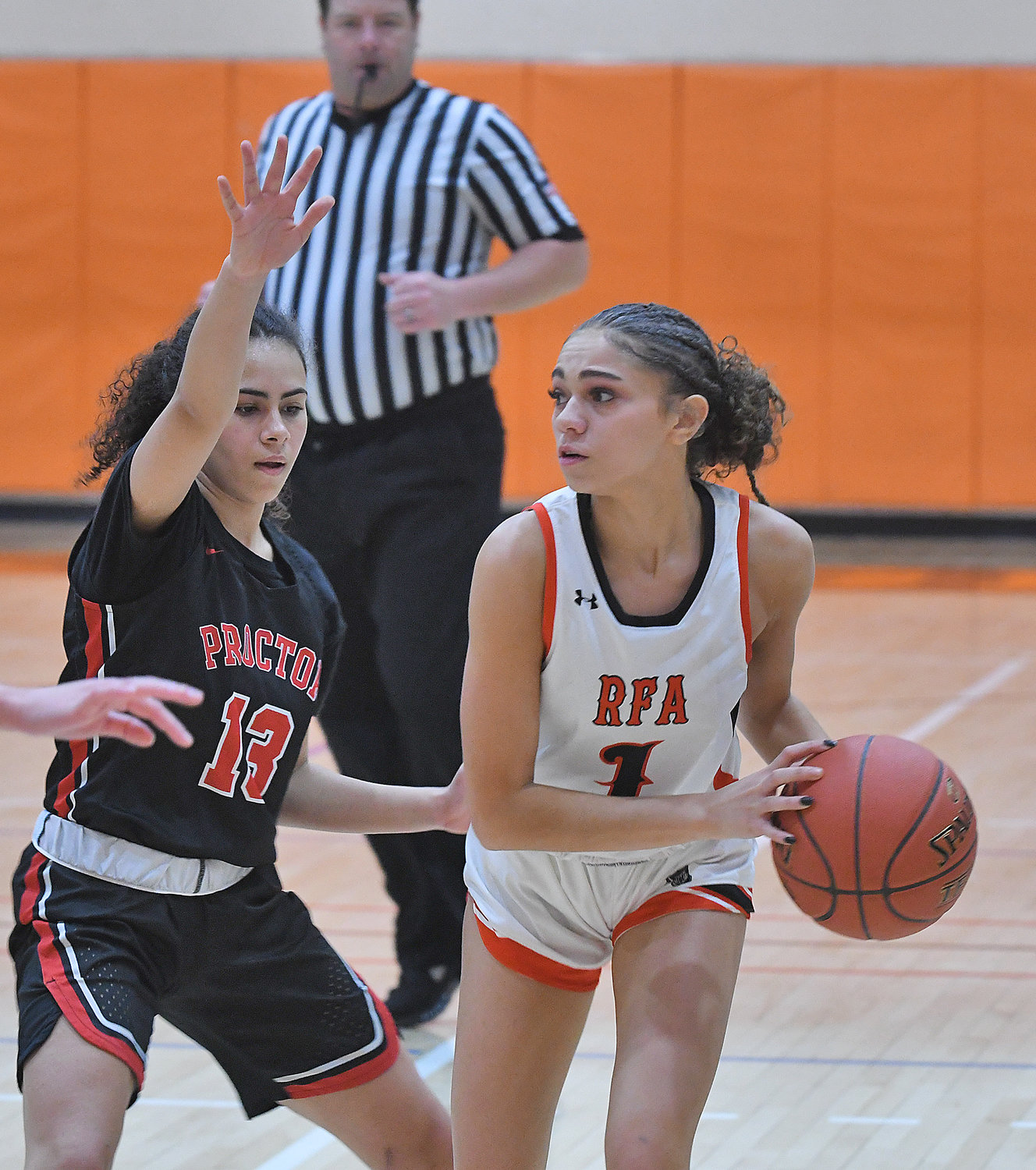 Alysa Jackson of Rome Free Academy looks over the court with Proctor’s Lleneila Rodriguez defending Saturday at RFA. Jackson had a game-high 22 points in RFA’s 66-34 win.
