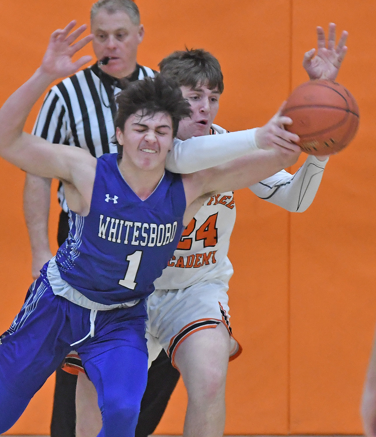Whitesboro's Anthony Dorozynski, left, and Rome Free Academy's Luke Hammon battle for the ball in the first half Tuesday night. The Black Knights won 52-37 at home in the Tri-Valley League.