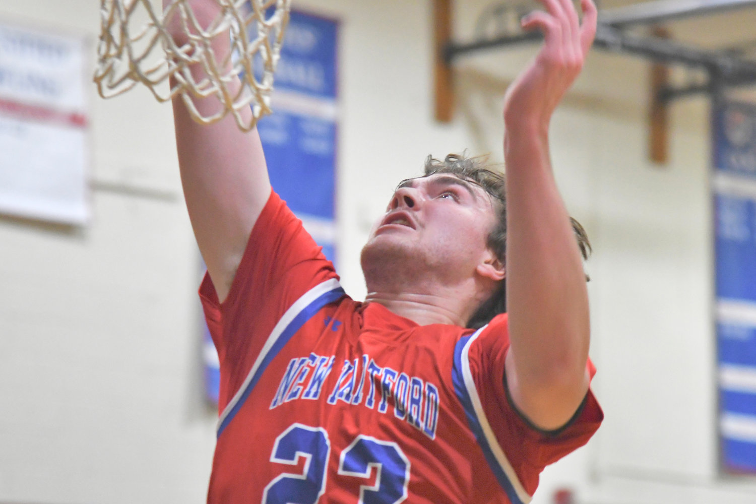 New Hartford's Zach Philipkoski goes up for a loose ball on Tuesday in a game against Thomas R. Proctor. Philipkoski became the school's all-time leader in points in the game.