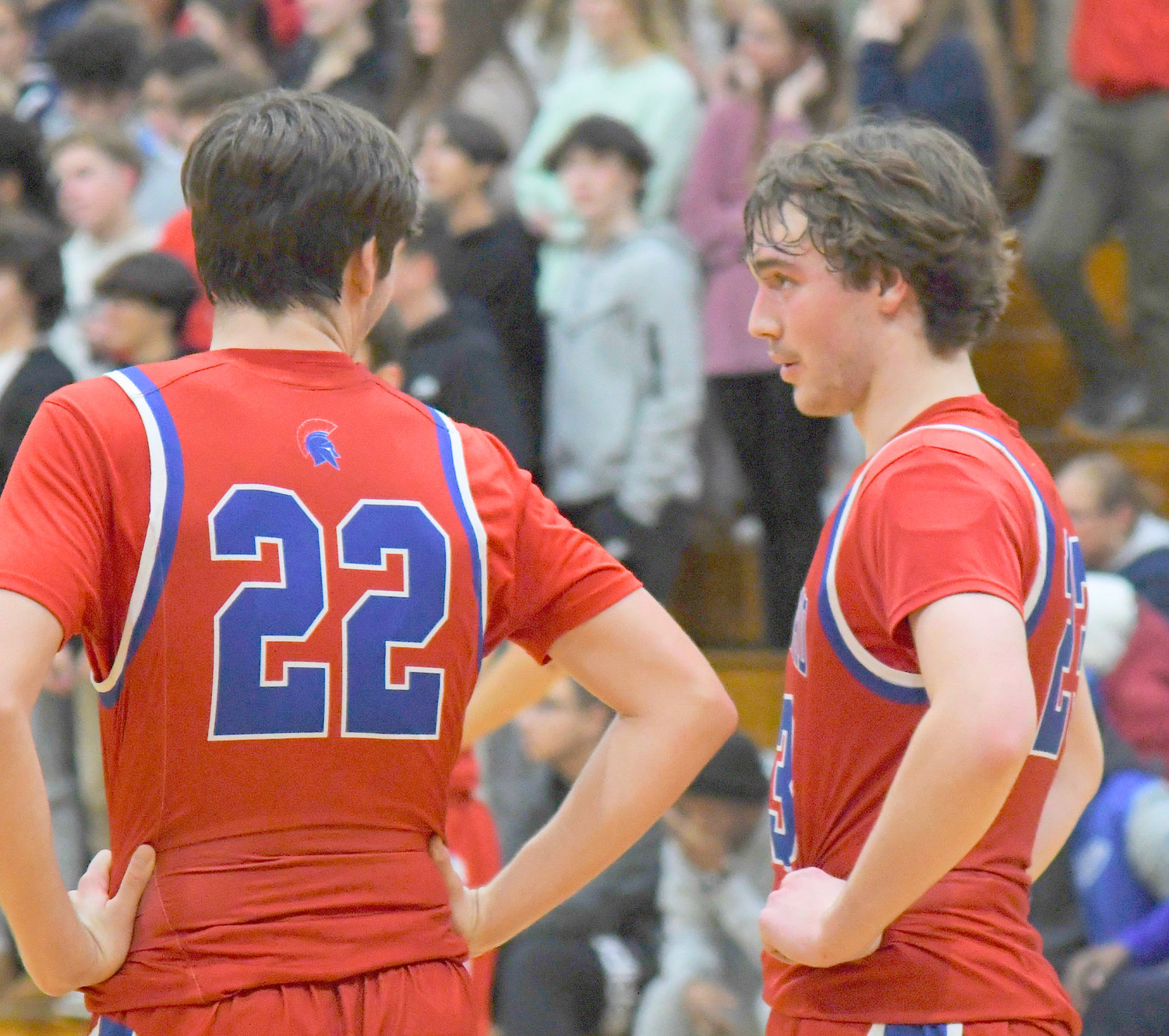Zach Philipkoski, right, talks with teammate Colton Suriano during Tuesday's win over Proctor. Philipkoski and Suriano are each seniors for the Spartans.
