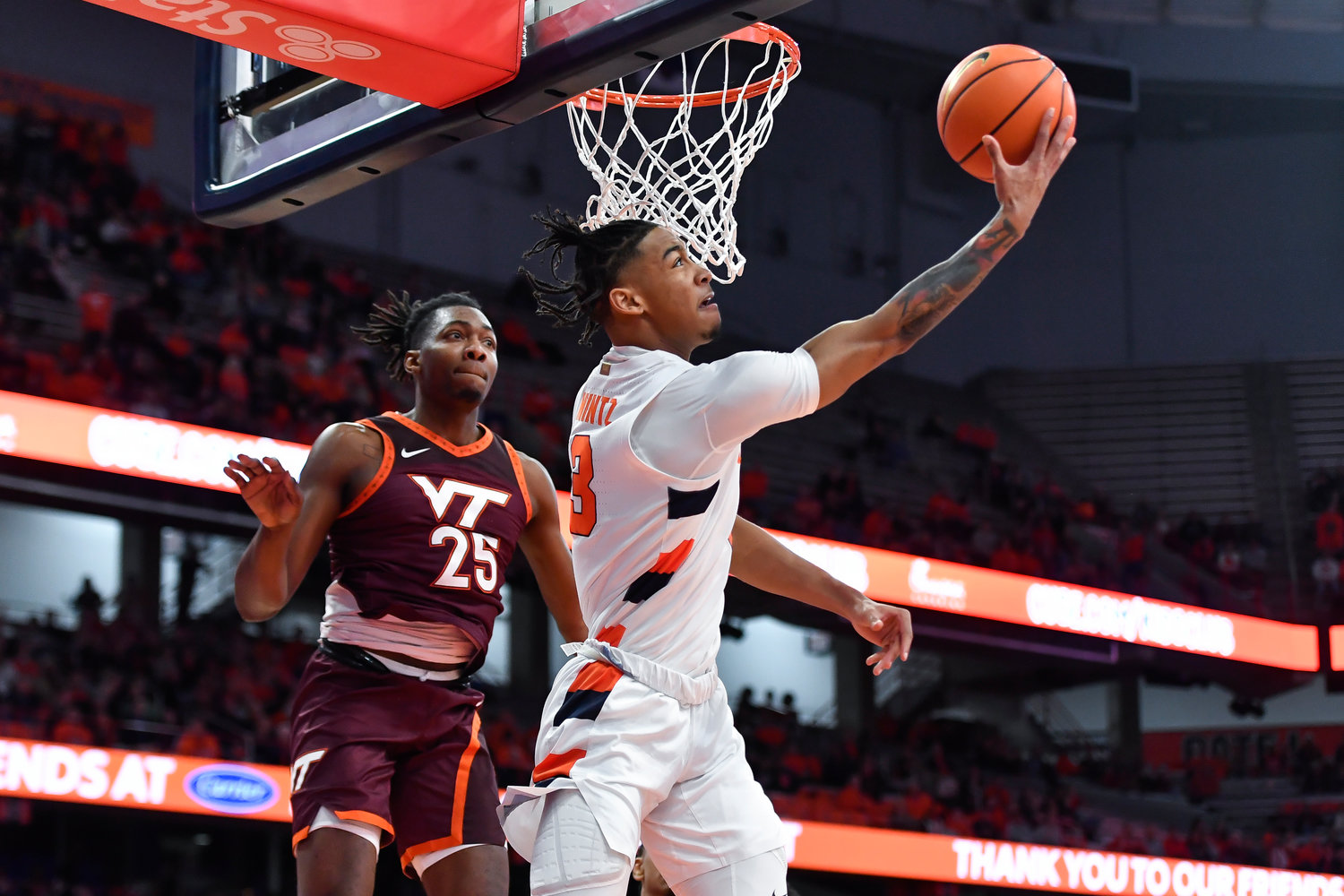 Syracuse guard Judah Mintz shoots against Virginia Tech forward Justyn Mutts during the second half of Wednesday night's game in Syracuse. The Orange won 82-72.