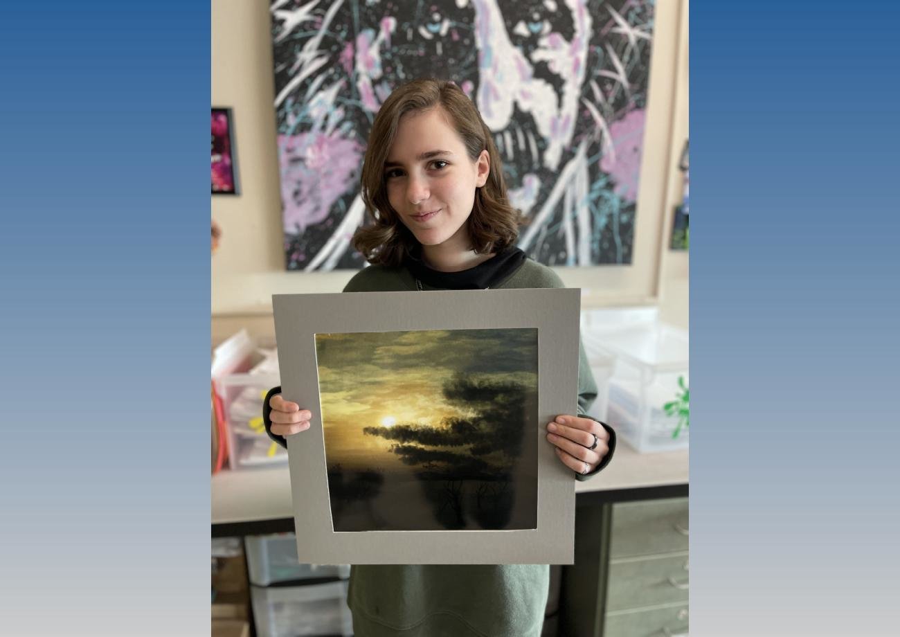 Herkimer Central School District sophomore Jillian Hutchinson won a Silver Key Award in the 2023 Central New York Scholastic Art Awards. She poses here with her winning piece, digital art that she created on an iPad using the app Procreate.