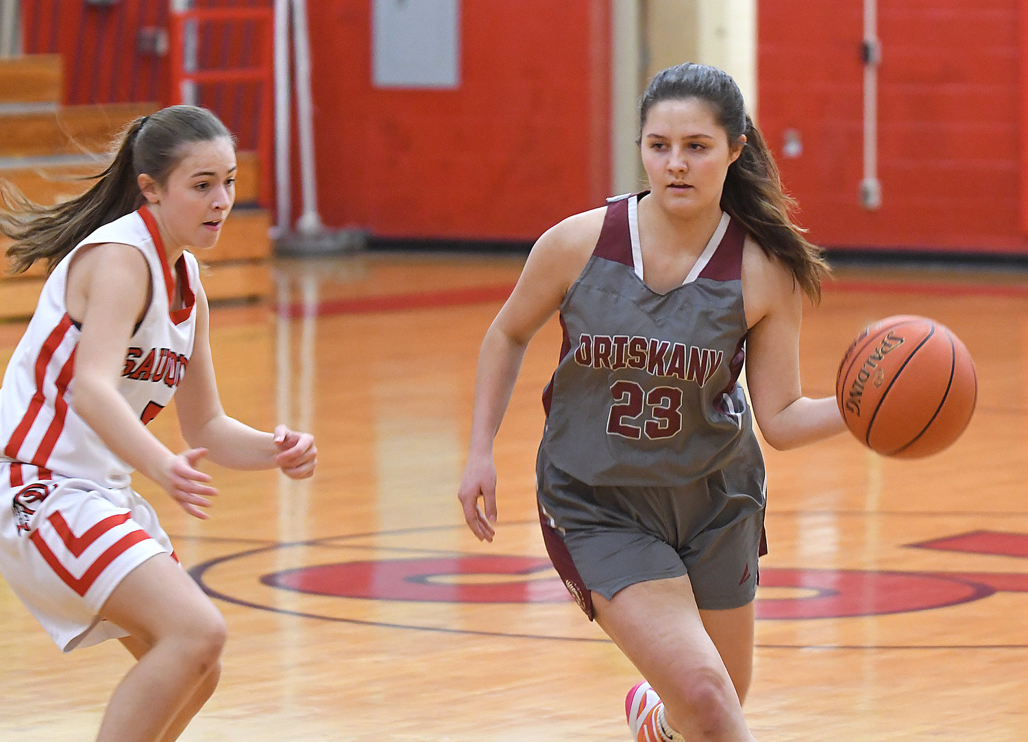 Oriskany's Jordyn Coleman dribbles up the lane defended by Sauquoit Valley's Julia Zegarelli in the first quarter Wednesday night at Sauquoit Valeey High School. Coleman led her team with 13 points in a 44-30 win.
