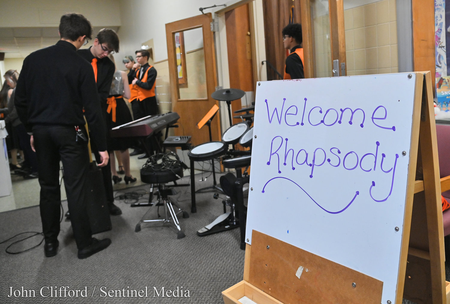 RFA Rhapsody Show Choir and band arrive at Clough School Thursday, January 13, 2023 and prepare for their first performance of music and dance on their tour of Rome elementary schools.