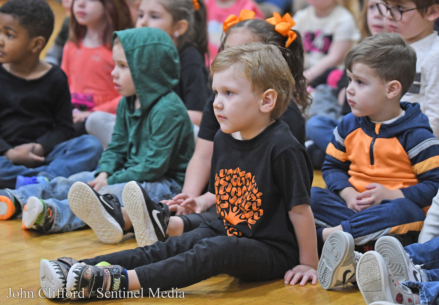 Clough Pre-K students listening to the Rome Free Academy Rhapsody Show Choir performing at Clough School Friday, January 13, 2023.
