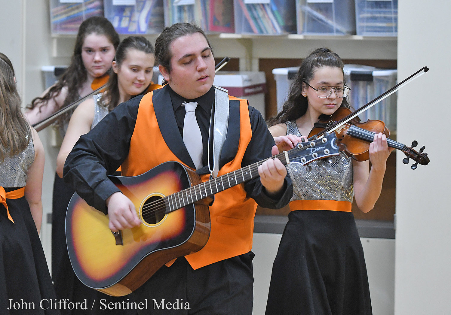Jake Consentino plays the guitar during Rome Free Academy Rhapsody Show Choir performance at Clough School Friday, January 13, 2023.