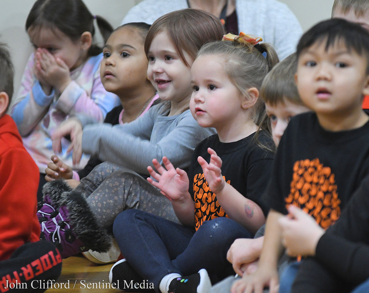 Happy Clough Pre-K students reacting to the Rome Free Academy Rhapsody Show Choir performing at Clough School Friday, January 13, 2023.