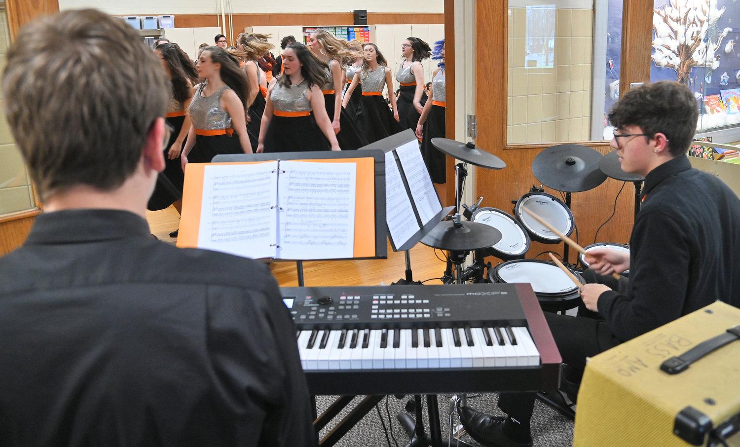 The Rome Free Academy Rhapsody Show Choir performs Friday, Jan. 13 at Clough School in Rome. The band was out in the hallway and singers and dancers were in the gym.