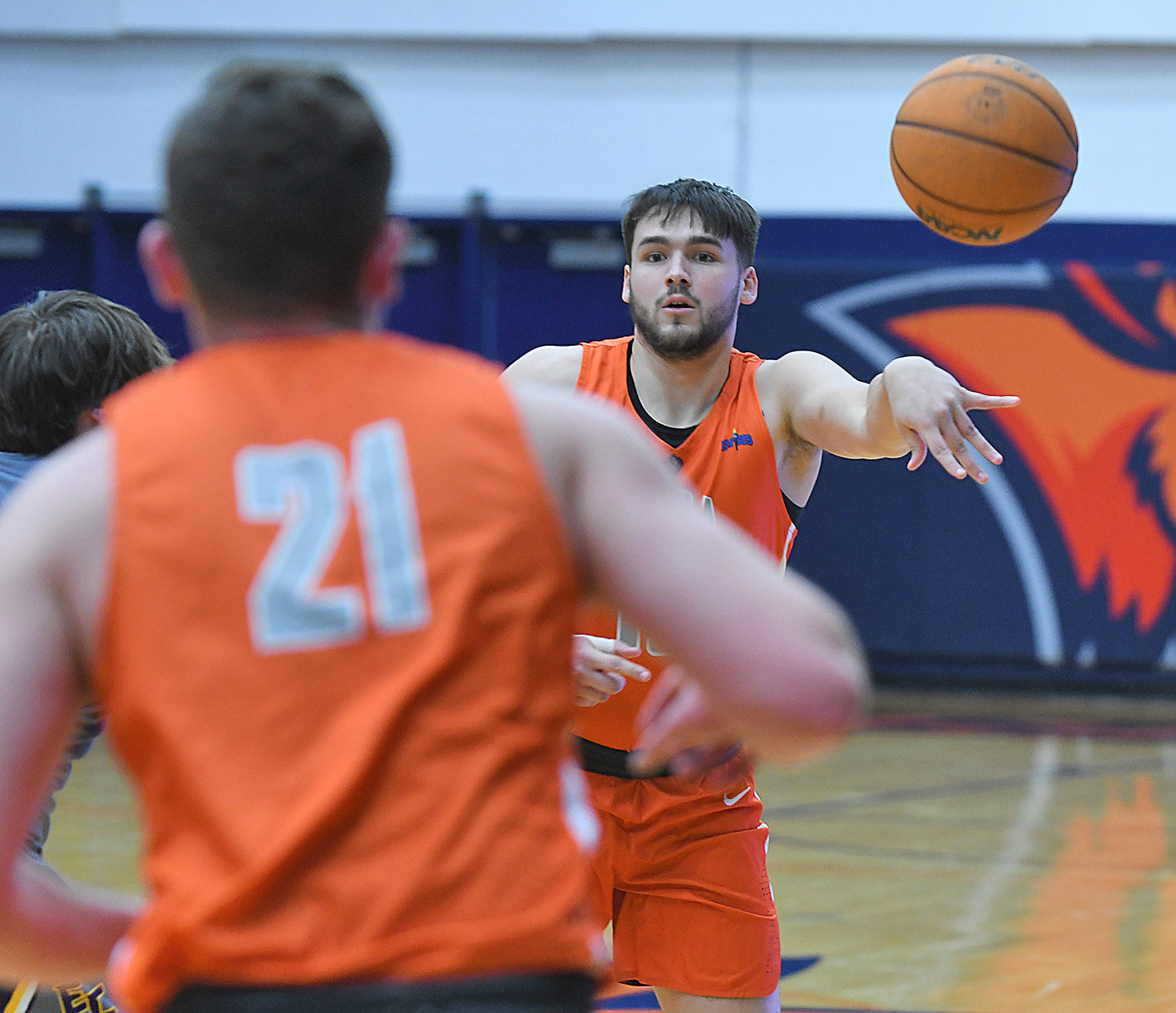 Utica University’s Damien Call passes the ball down to teammate Thomas Morreale during Friday night’s Empire 8 game against visiting Elmira College at Clark Athletic Center. The Pioneers won 72-53.