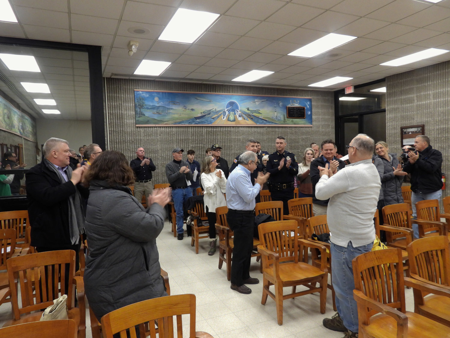 Police Chief John Little receives a standing ovation at Tuesday's Common Council meeting.