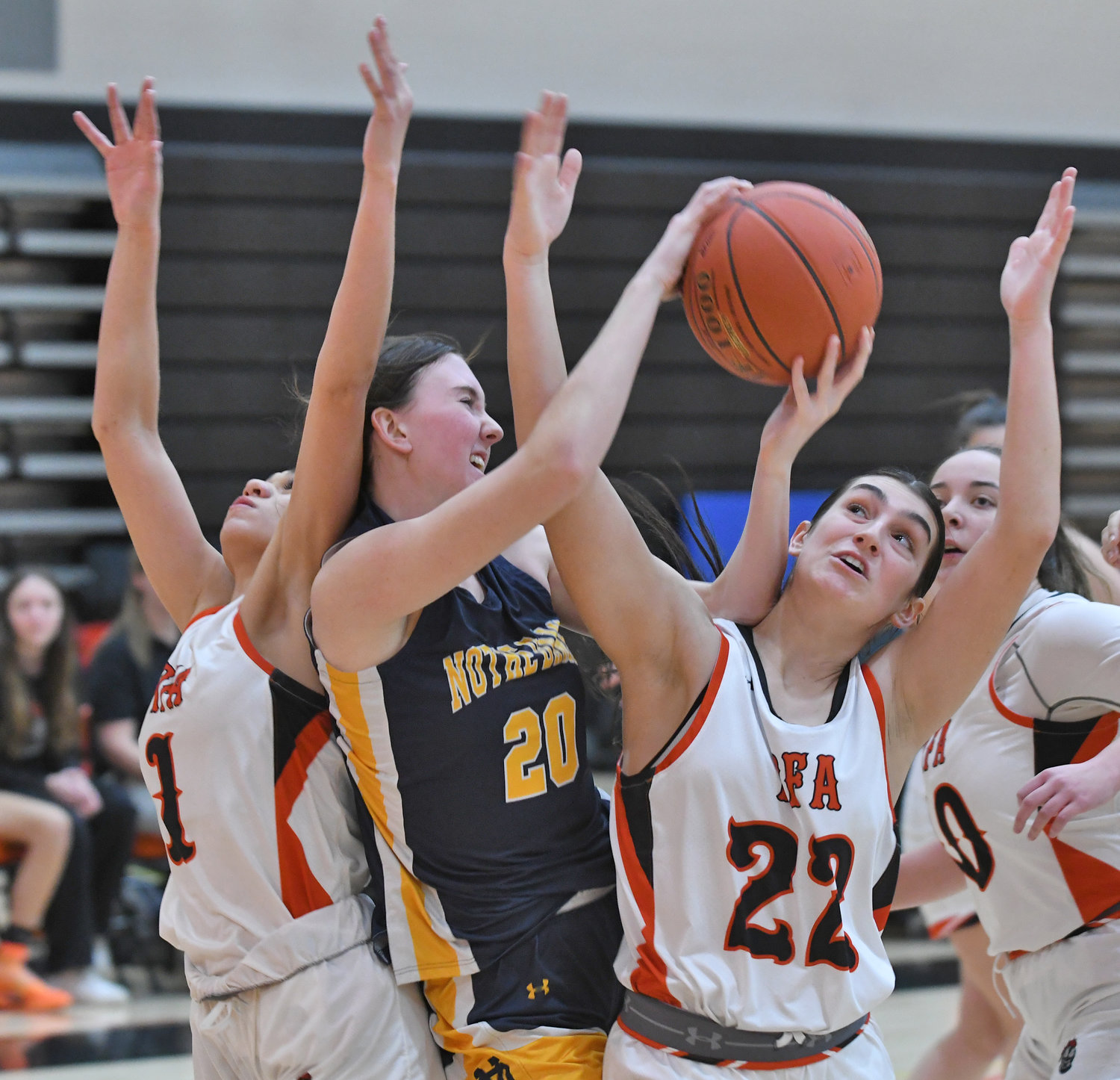 Alysa Jackson, left, and Mia Mirabelli of Rome Free Academy surround Utica-Notre Dame’s Ella Trinkaus in a battle for the ball Tuesday at RFA. Trinkaus led the Jugglers with 24 points but RFA won 62-54. Jackson and Mirabelli scored 10 each.