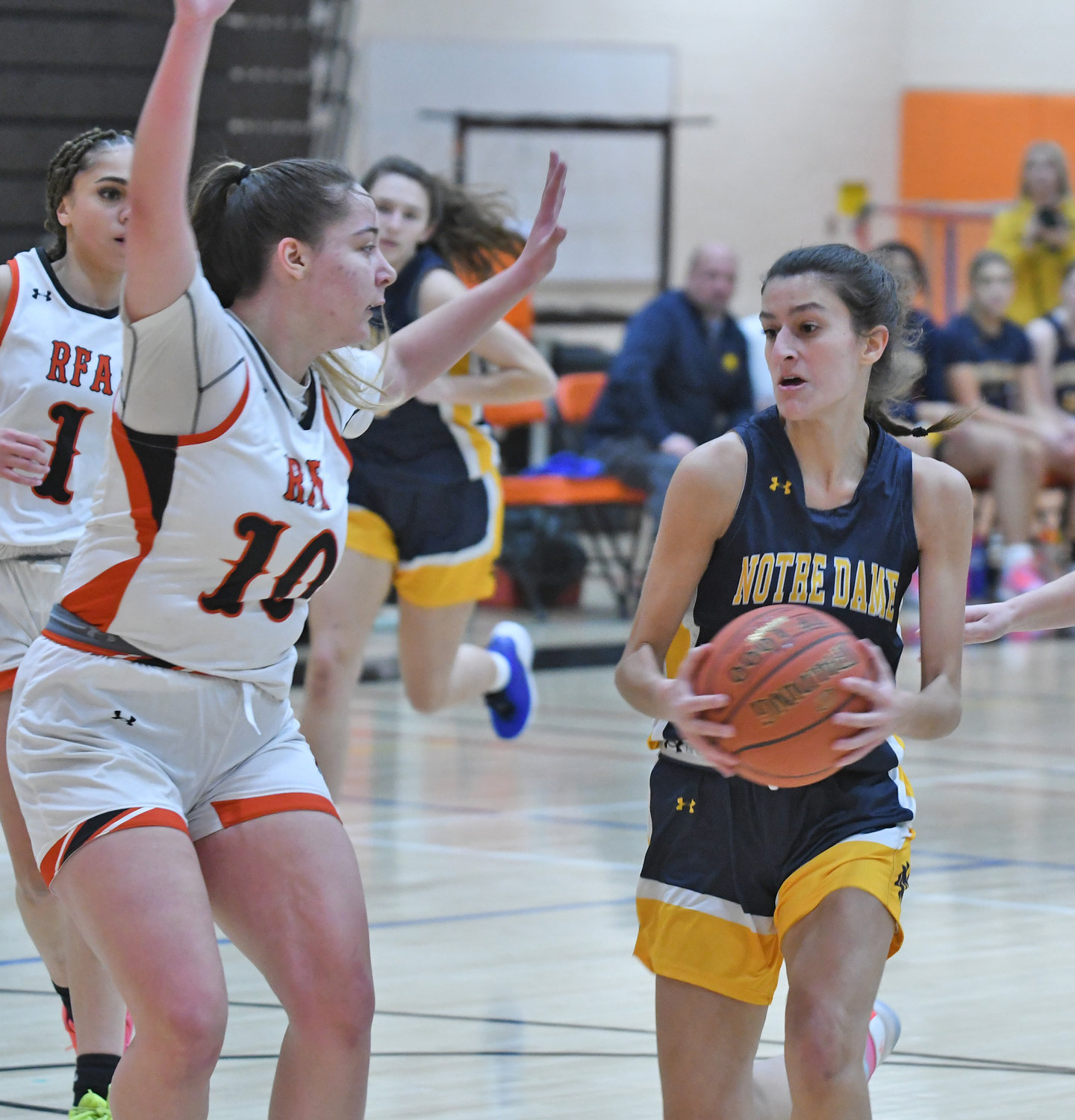Alexa Durso of Utica-Notre Dame drives on Rome Free Academy defender Raelyn Dole Tuesday night at RFA. The Black Knights won at home 62-54.