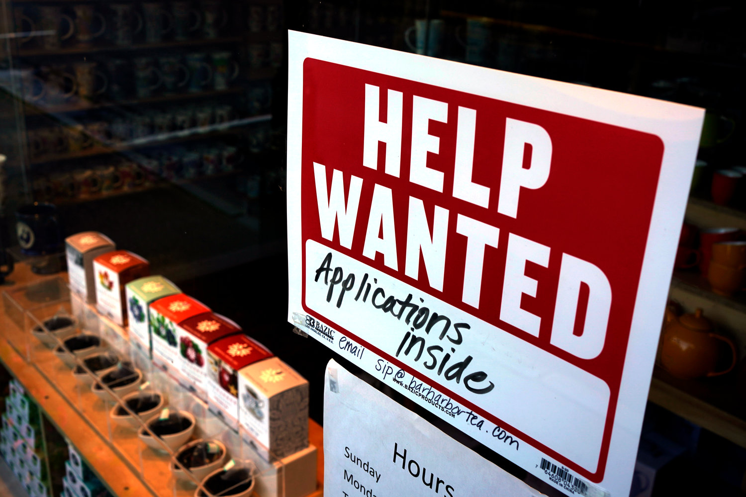 File - A help-wanted sign hangs in the front window of the Bar Harbor Tea Room, Saturday, June 11, 2022, in Bar Harbor, Maine. On Thursday, the Labor Department reports on the number of people who applied for unemployment benefits last week. (AP Photo/Robert F. Bukaty, File)
