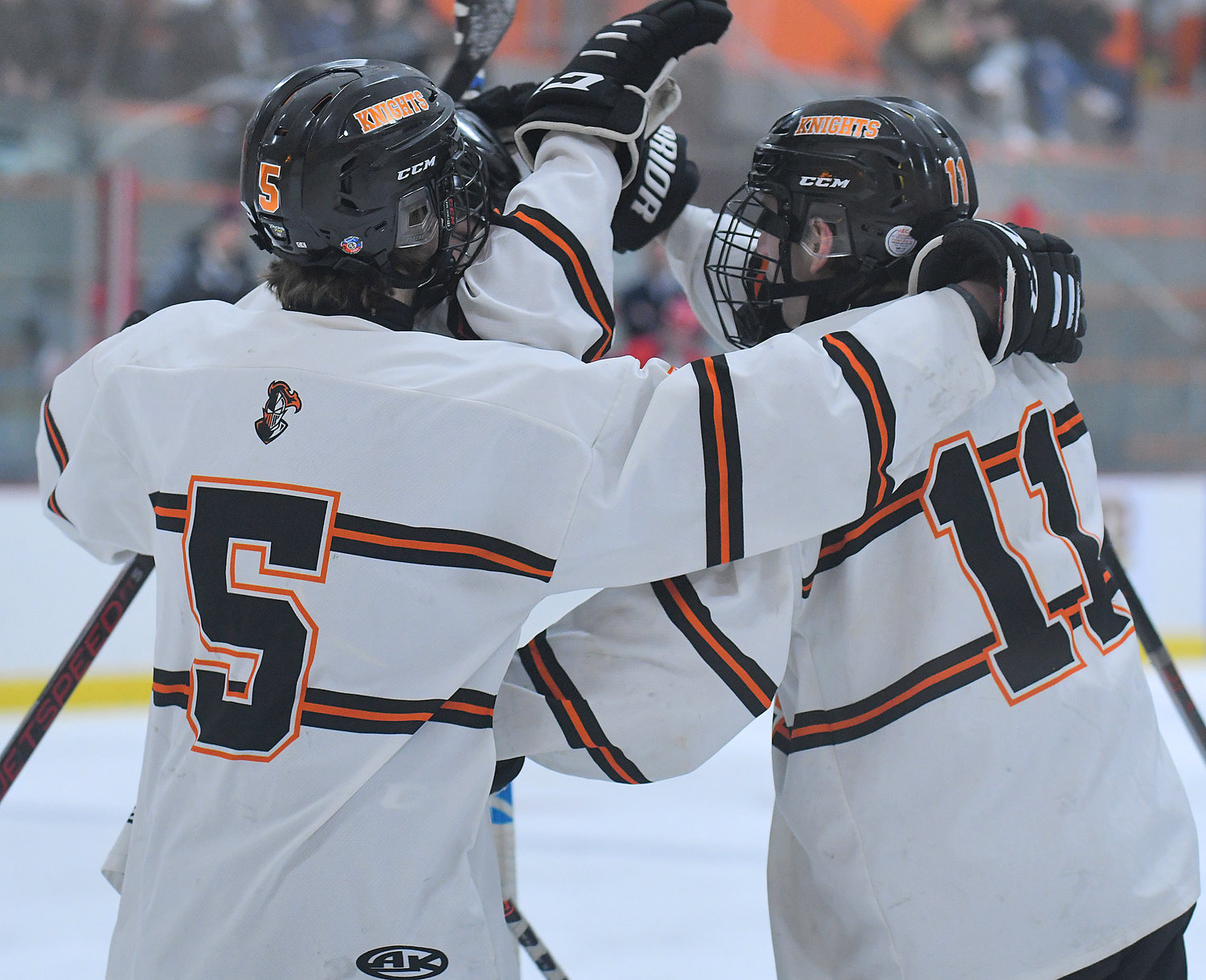 Rome Free Academy players Chris Brement, left, and John Sharrino celebrate Sharrino's goal in the first period Friday afternoon at Kennedy Arena. Sharrino had a hat trick and two assists and Brement also scored in the team's 10-0 win.