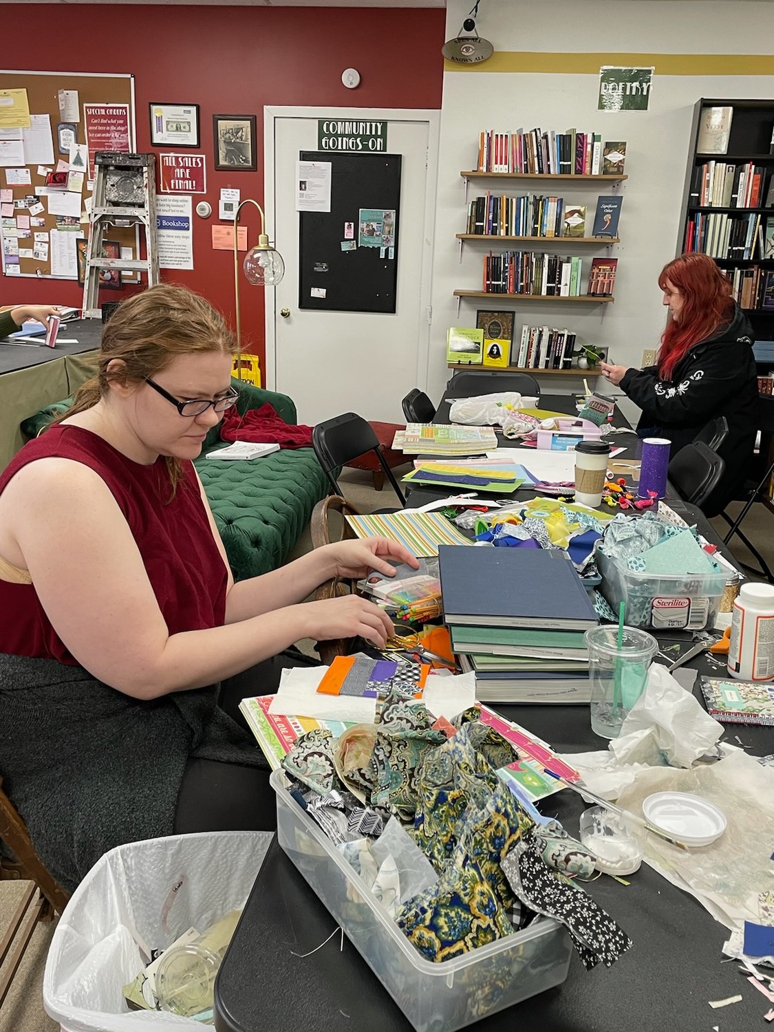 Readers get crafty as they take part in a journal making workshop at Keaton & Lloyd Bookshop, 236 W. Dominick St., in Rome.