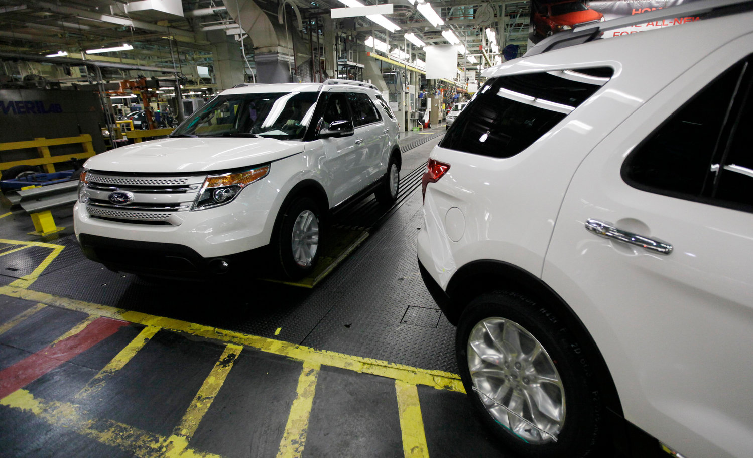 Plant employees drive 2011 Ford Explorer vehicles off the assembly line at Ford's Chicago Assembly Plant in Chicago in this December 2010 file photo. The U.S. government's road safety agency has closed a more than six-year investigation into Ford Explorer exhaust odors, determining that the SUVs don't emit high levels of carbon monoxide and don't need to be recalled.
