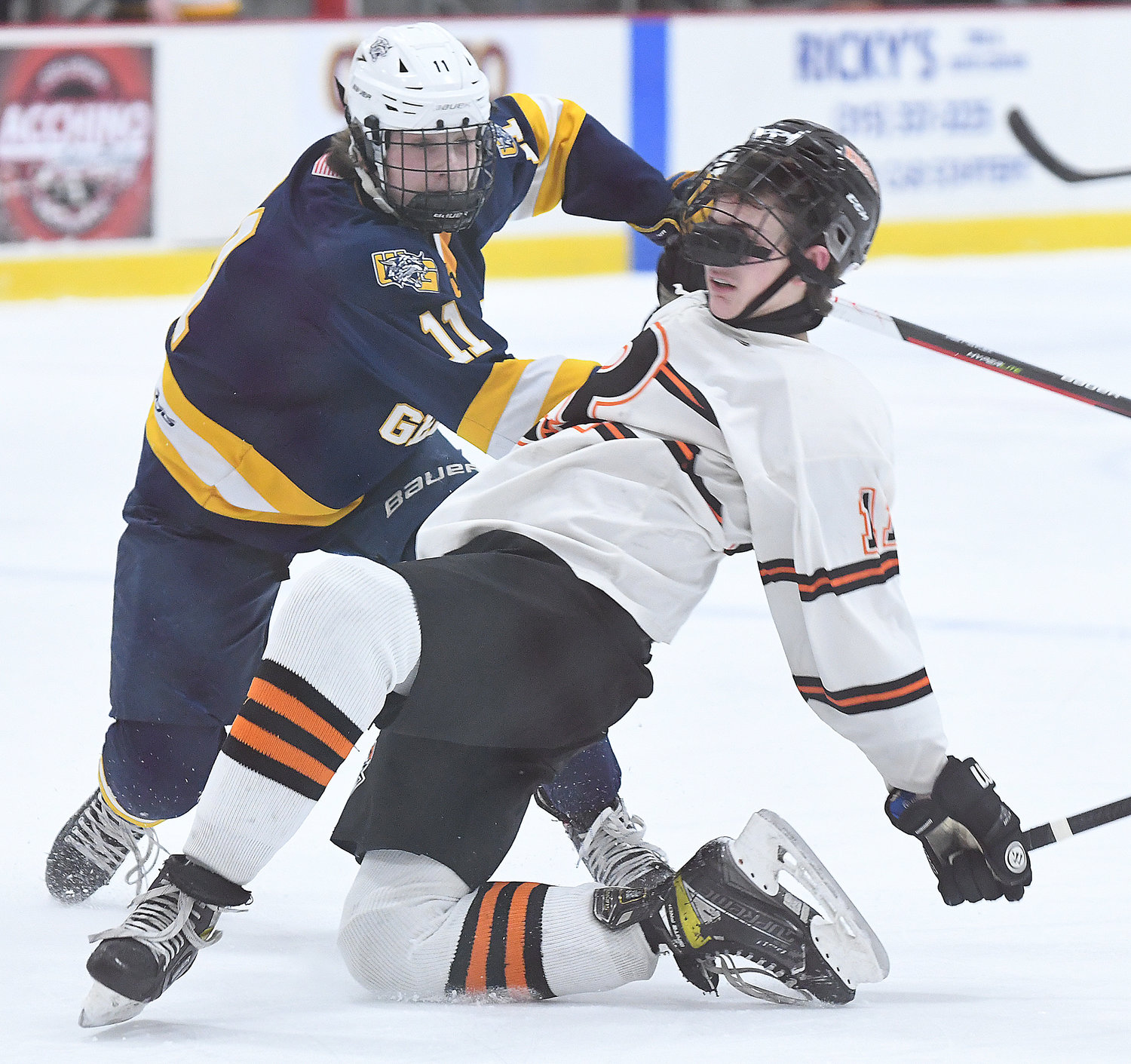Rome Free Academy forward John Sharrino, right, collides with West Genesee's William Schneid during the first period at Kennedy Arena Tuesday night. Schneid had two goals in the Wildcats' 10-1 win.