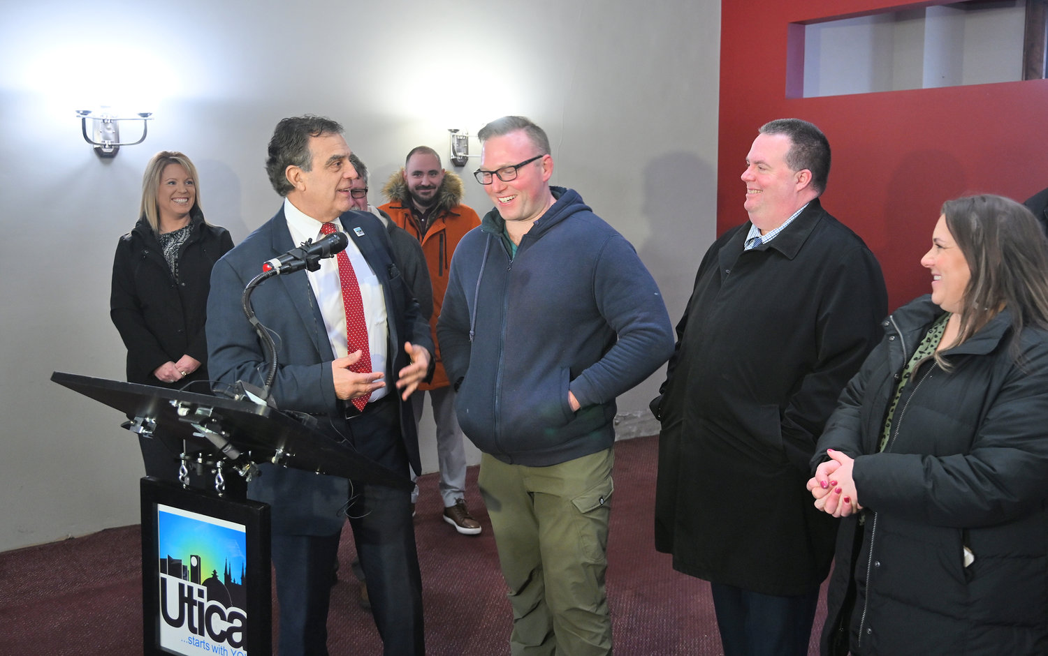 Mayor Palmieri and Travis McNeil share a laugh in the building on 238 Genesee St that he will completely rehabilitate Tuesday, January 24, 2023.