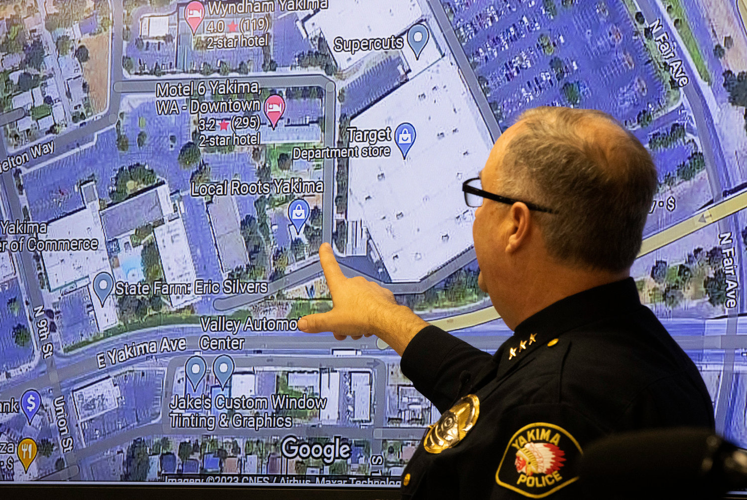 Yakima Police Chief Matt Murray points to a map showing where Jarid Haddock was found with a self-inflicted gunshot wound Tuesday, Jan. 24, in Yakima, Wash. Police located Haddock, the suspect in the random killing of three people at a convenience store in Yakima, after he borrowed a stranger’s cell phone to call his mother and confess to what he had done.