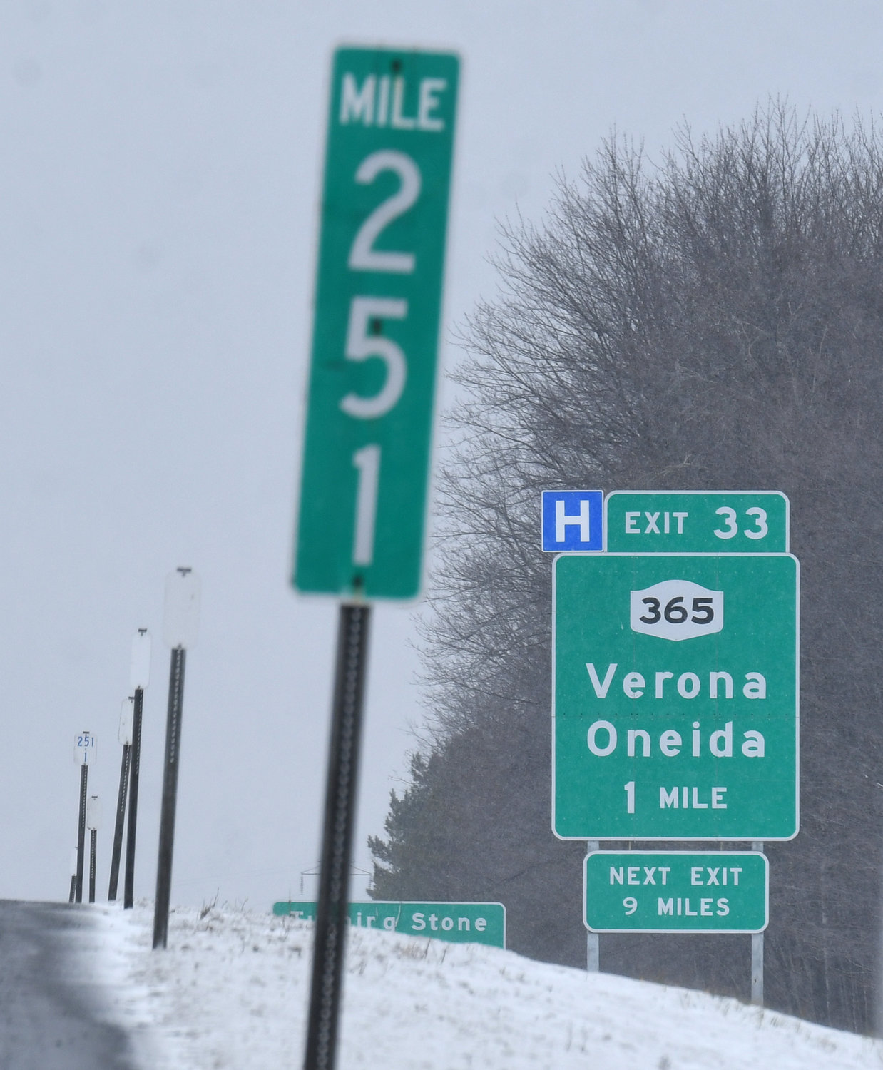 A mile marker is shown along the side of the New York State Thruway with the sign for Exit 33 for Route 365 Verona/Oneida in the background on Thursday. State Sen. Joseph A. Griffo, R-53, Rome, is urging state officials to study and implement a switch to mile-based numbers for the exits as opposed to the current sequential numbers.