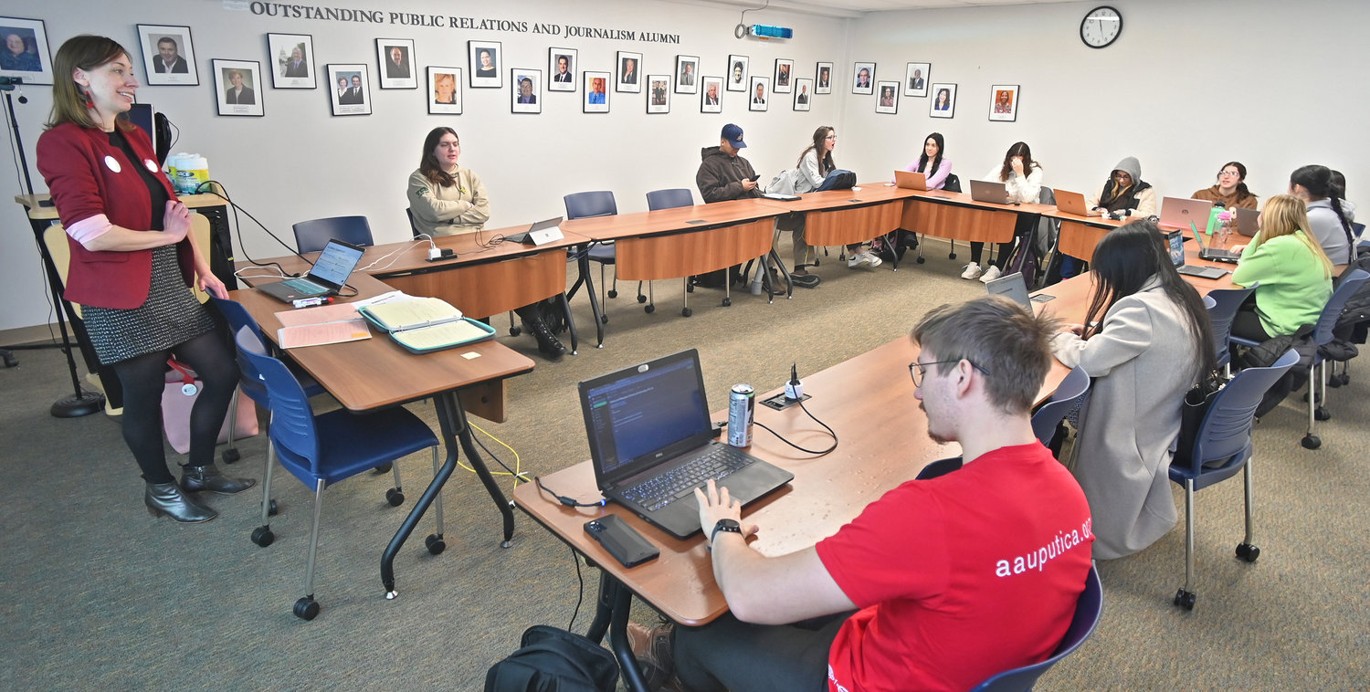 Leonore Fleming, left, teaches students in her philosophy class Thursday, Jan. 26 in Hubbard Hall at Utica University.
