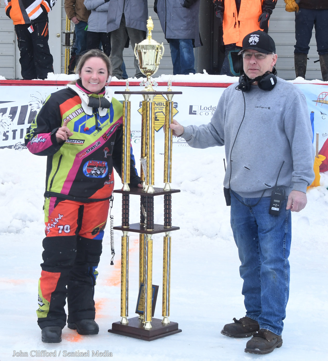 Sabrina Blanchet from Drummondville, Canada in victory lane after winning the 440 Super Modified Adirondack Cup with Snow Festtival race director Tony Petinelli Sunday afternoon at Boonville Fairgrounds.