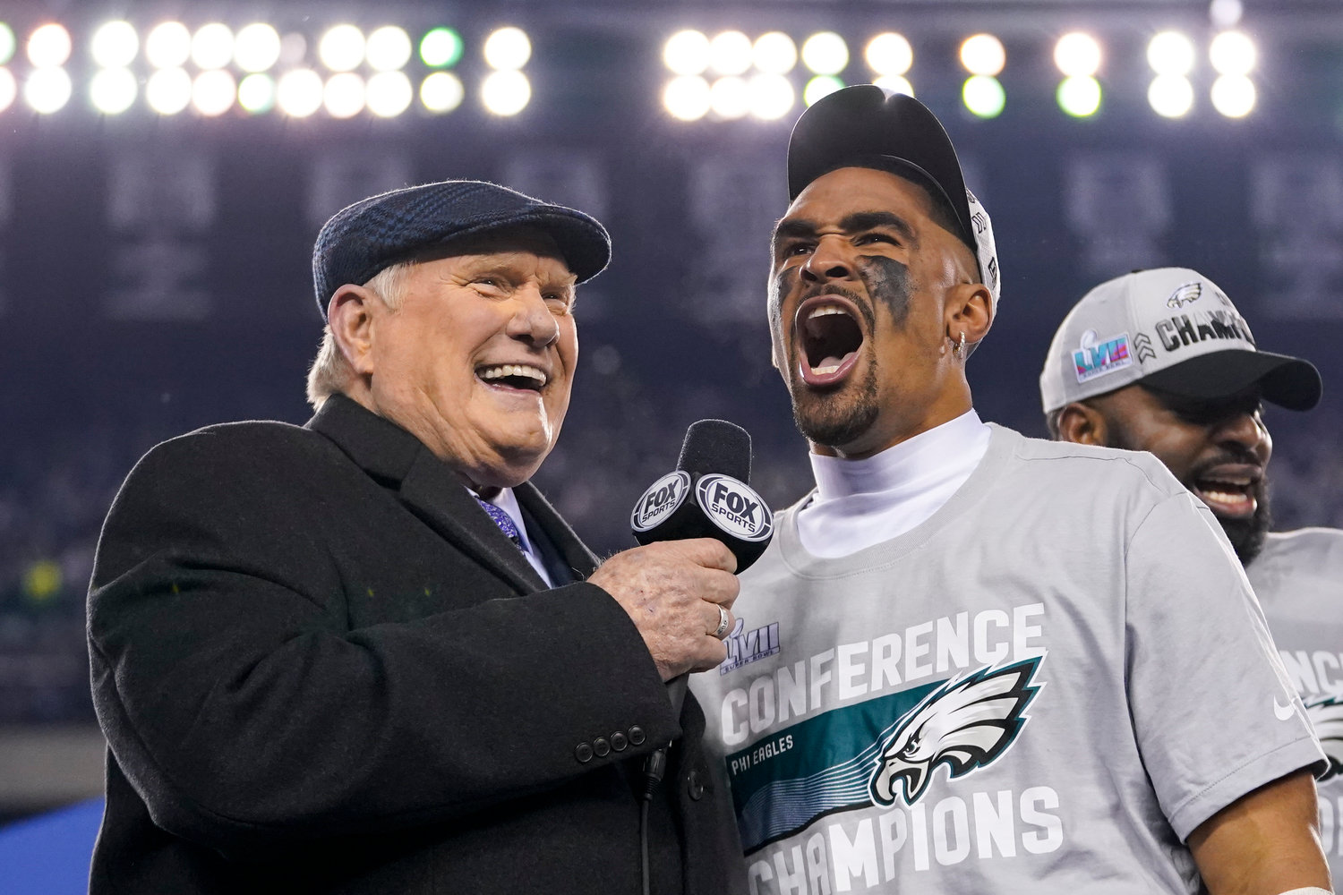 Philadelphia Eagles quarterback Jalen Hurts, center, reacts while speaking toTerry Bradshaw, left, after the NFC Championship NFL football game between the Philadelphia Eagles and the San Francisco 49ers on Sunday, Jan. 29, 2023, in Philadelphia. The Eagles won 31-7.