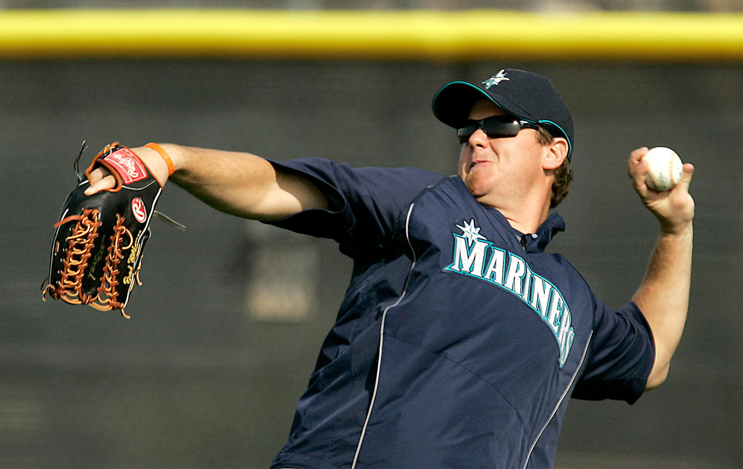 Seattle Mariners outfielder Brad Wilkerson throws the ball during spring training on Feb. 18, 2008, at the team's complex in Peoria, Ariz. Wilkerson was hired as the New York Yankees' assistant hitting coach on Monday.