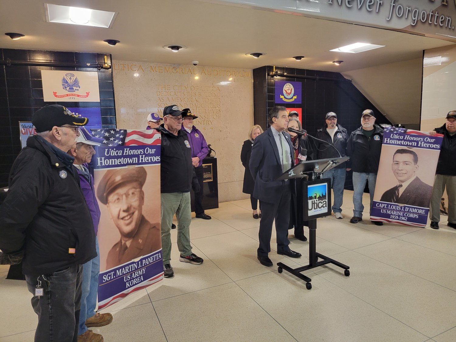 Utica Mayor Robert Palmieri, assisted by local veterans and volunteers, unveils the expansion of the city’s Hometown Heroes Banner Program, which will now include the newly-renovated Oriskany Boulevard corridor.