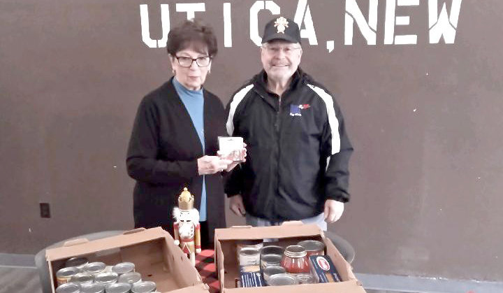 The Knights of Columbus Fourth Degree Utica Assembly 733 has made several recent donations to the Veterans Outreach Center, 726 Washington St. in Utica. The donations included 20 $15 gift cards for groceries, 55 turkeys and three large boxes of food items, and several bags of clothing and blankets. Making donations to the Veterans Outreach Center has been a year-round program since November 2017. From left: Ann Scalise, business officer for the Veterans Outreach Center, and Robert Gondek, past faithful navigator of the Knights of Columbus.
