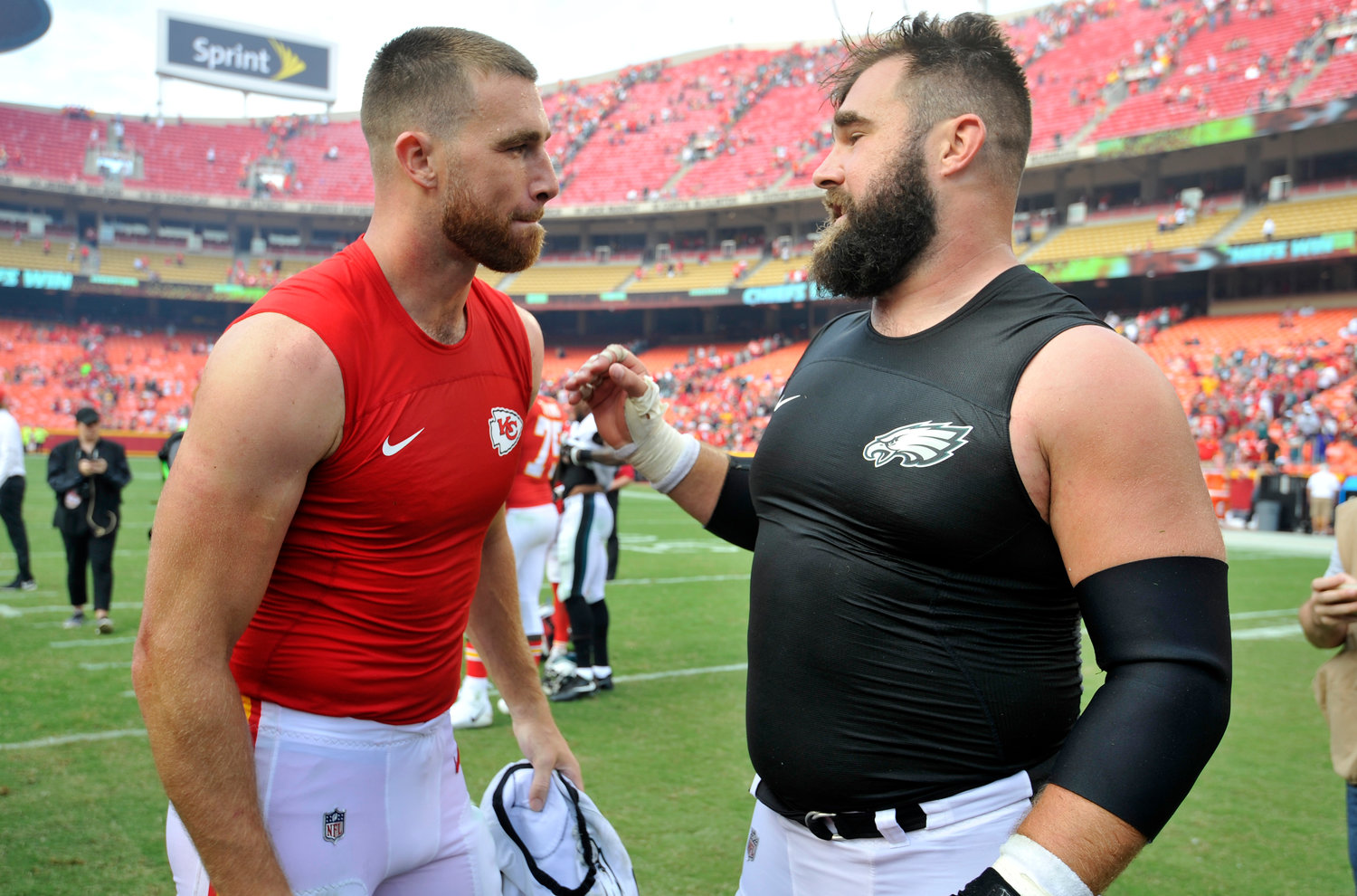 Kansas City Chiefs tight end Travis Kelce, left, talks to his brother, Philadelphia Eagles center Jason Kelce, after they exchanged jerseys following an NFL football game in Kansas City, Mo., Sept. 17, 2017. For the first time in Super Bowl history, a pair of siblings will play each other on the NFL's grandest stage. Travis helped the Chiefs return to their third championship game in four seasons on Sunday night when they beat the Bengals for the AFC title, while Jason has the Eagles back for the second time in six years after their NFC title win over the 49ers.